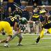 Michigan senior quarterback Denard Robinson evades being tackled by Michigan State linebacker Kyler Elsworth on Saturday. Michigan won 12-10. Daniel Brenner I AnnArbor.com